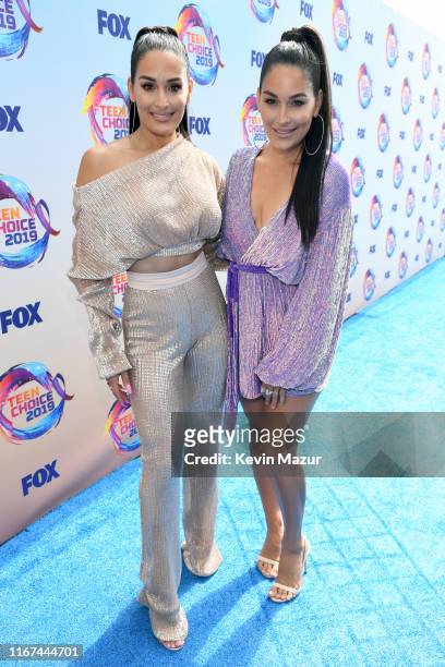 Nikki Bella and Brie Bella, aka The Bella Twins, attend FOX's Teen Choice Awards 2019 on August 11, 2019 in Hermosa Beach, California.