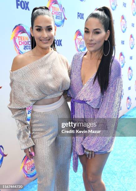 Nikki Bella and Brie Bella, aka The Bella Twins, attend FOX's Teen Choice Awards 2019 on August 11, 2019 in Hermosa Beach, California.