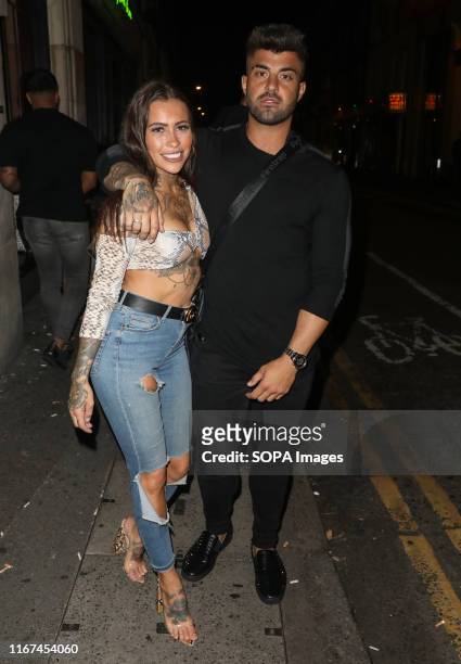 Terri Altilar and Rogan O'Connor attending the LFW: Exempt Society Preview Party at Nikki's Bar in London.