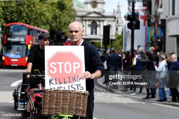 Co-founder Stop Killing Cyclists, Donnachadh McCarthy holding a placard during the demonstration. Cyclists participated in a funeral procession...