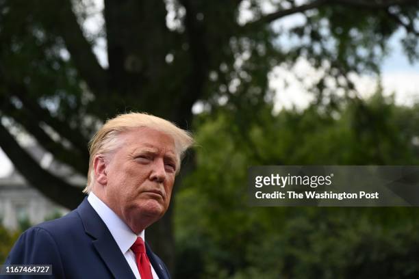 Donald Trump addresses the media as he departs the White House en route to Joint Base Andrews, from where he will head to a political rally in North...