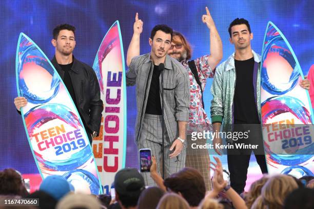Nick Jonas, Kevin Jonas and Joe Jonas of Jonas Brothers accept the Teen Choice Decade Award onstage during FOX's Teen Choice Awards 2019 on August...