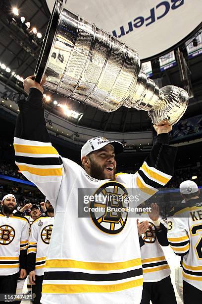 Nathan Horton of the Boston Bruins celebrates with the Stanley Cup after defeating the Vancouver Canucks in Game Seven of the 2011 NHL Stanley Cup...