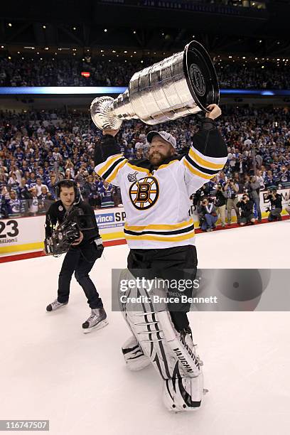 Tim Thomas of the Boston Bruins celebrates with the Stanley Cup after defeating the Vancouver Canucks in Game Seven of the 2011 NHL Stanley Cup Final...