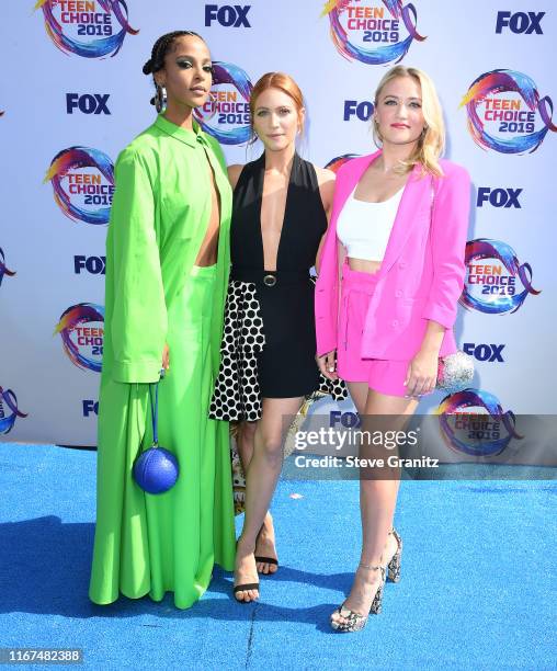 Megalyn Echikunwoke, Brittany Snow, and Emily Osment arrives at the FOX's Teen Choice Awards 2019 on August 11, 2019 in Hermosa Beach, California.