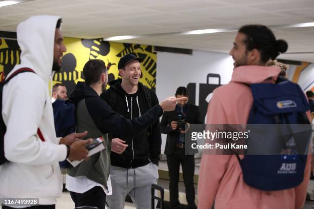 Joe Ingles of the Boomers looks on with Chris Goulding after arriving at Perth Airport on August 12, 2019 in Perth, Australia.