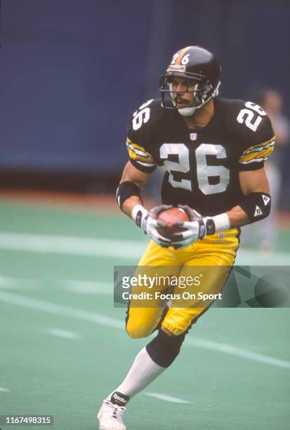 Rod Woodson of the Pittsburgh Steelers runs with the ball during an NFL football game circa 1989 at Three Rivers Stadium in Pittsburgh, Pennsylvania....