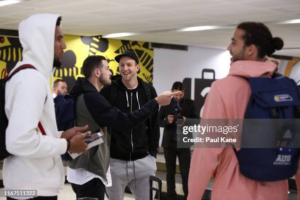 Chris Goulding and Joe Ingles of the Boomers chat after arriving at Perth Airport on August 12, 2019 in Perth, Australia.