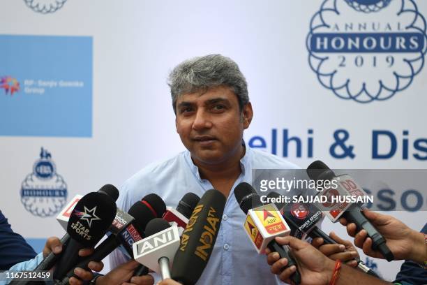 Former cricket player Ajay Jadeja speaks with the media at the Delhi cricket association ceremony to rename the Feroz Shah Kotla cricket stadium to...