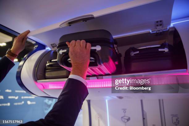 Carry-on bag space detecting overhead bin is demonstrated at the Airbus SE booth during the APEX Expo in Los Angeles, California, U.S., on Wednesday,...