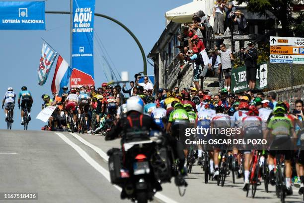 The pack rides in Puerto de Navacerrada during the 18th stage of the 2019 La Vuelta cycling Tour of Spain, a 177,5 km race from Colmenar Viejo to...