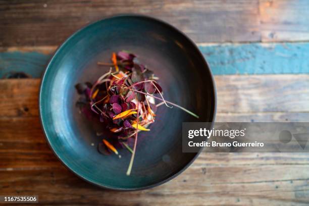 flower based vegetarian plate on rustic wooden table - copenhagen food stock pictures, royalty-free photos & images