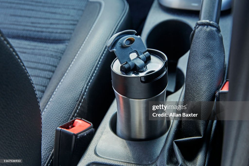 Metal Reusable Coffee Cup In Coffee Cup Holder Inside Car High-Res Stock  Photo - Getty Images