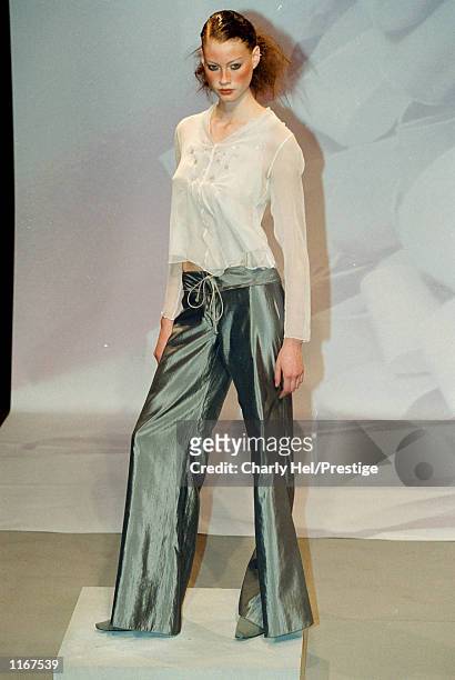 Model wears an outfit from the Marithe + Francois Girbaud Spring/Summer 2002 ready-to-wear fashion collection October 11, 2001 in Paris.