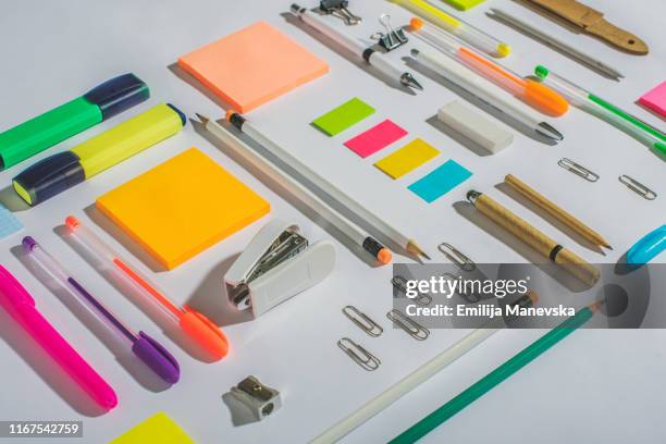 group of school or office supplies on white table - office still life stock pictures, royalty-free photos & images