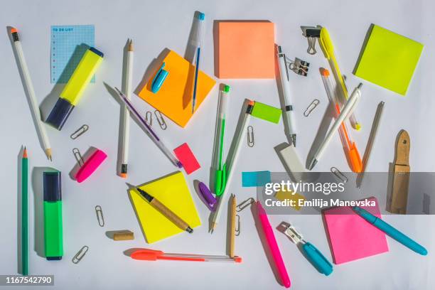 group of school or office supplies on white table - man made object imagens e fotografias de stock