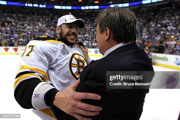 Milan Lucic and the Boston Bruins president Cam Neely celebrate after defeating the Vancouver Canucks in Game Seven of the 2011 NHL Stanley Cup Final...