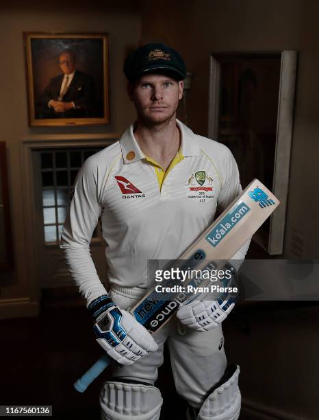 Australian Cricketer Steve Smith poses in the MCC Members Pavilion in front of a portrait of Sir Donald Bradman at Lord's Cricket Ground on August...