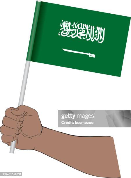 hand holding national flag of saudi arabia - saudi arabian flag stock illustrations