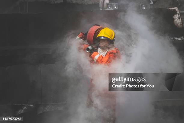 Firefigter Running Firefighter Running Into Fire Photos and Premium High Res Pictures ...