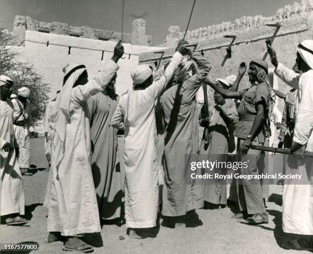 Start of a traditional Arab dance, using live ammunition - Trucial Oman Scouts, Buraimi Oasis, Abu Dhabi, United Arab Emirates.