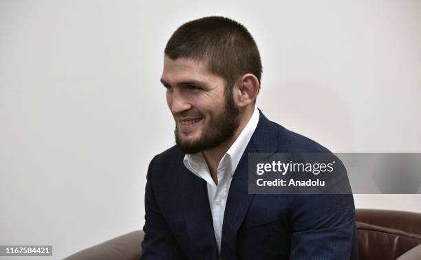 Russian mixed martial artist, UFC Lightweight Champion Khabib Nurmagomedov is seen during a meeting with Russian President Vladimir Putin , Head of...