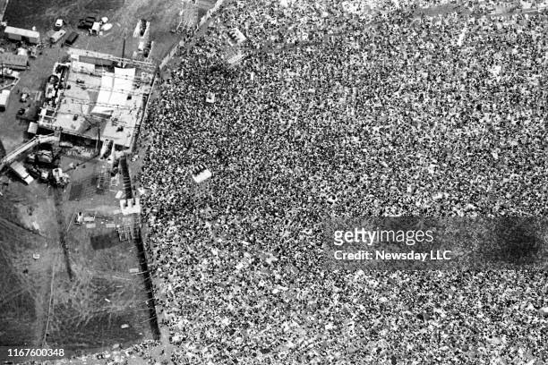 An aerial view of the crowd and stage at the Woodstock Music and Art Fair in White Lake, New York on August 17, 1969.