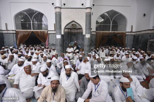 People congregate during a meeting for the resolution on Kashmir adopted by General Council of Jamait Ulama-E-Hind at its central office at ITO on...