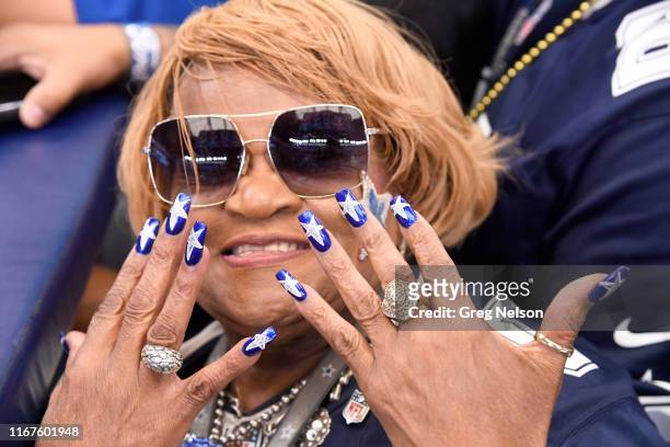 Closeup of Dallas Cowboys female fan in stands showing off her painted nails with stars before game vs New York Giants at AT&T Stadium. Arlington, TX...