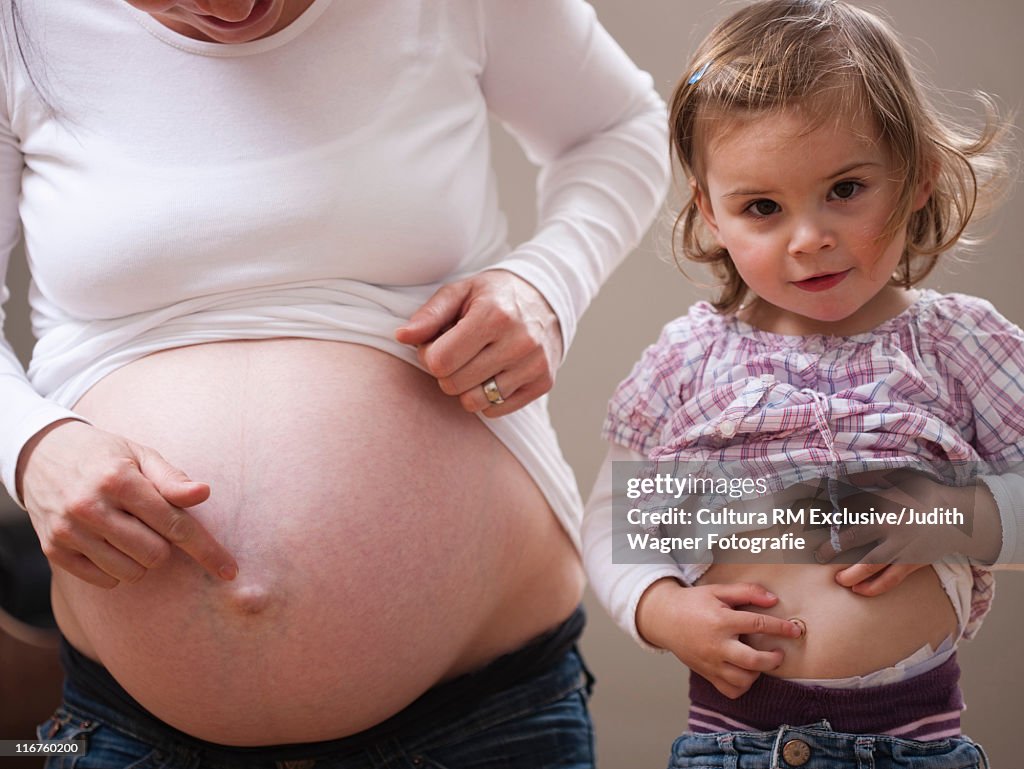 Girl and pregnant mothers bellies