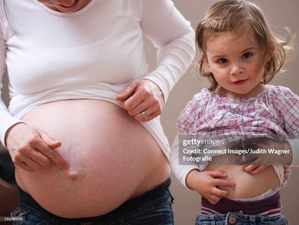 Girl and pregnant mothers bellies