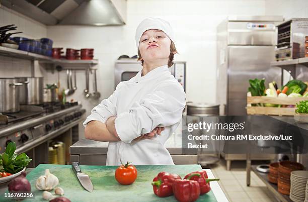 boy chef with vegetables in kitchen - chef portrait stock pictures, royalty-free photos & images