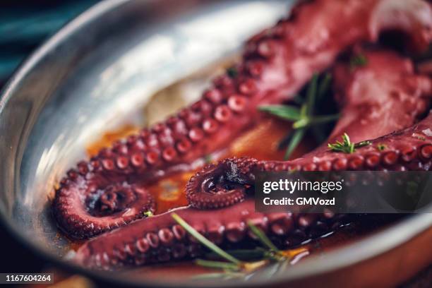 octopus tentacles with sea salt and fresh lemon - calamari stock pictures, royalty-free photos & images