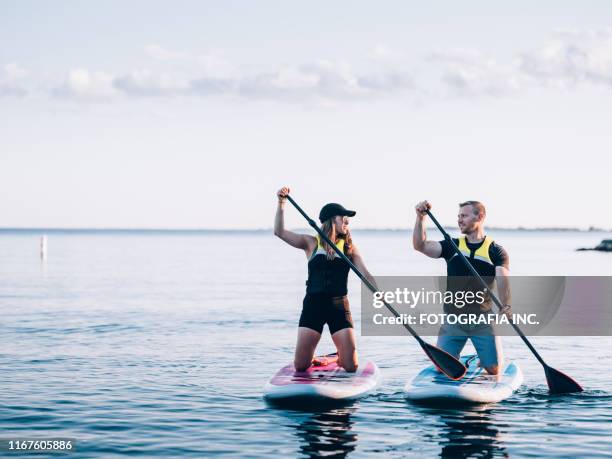 on the lake - paddleboard stock pictures, royalty-free photos & images