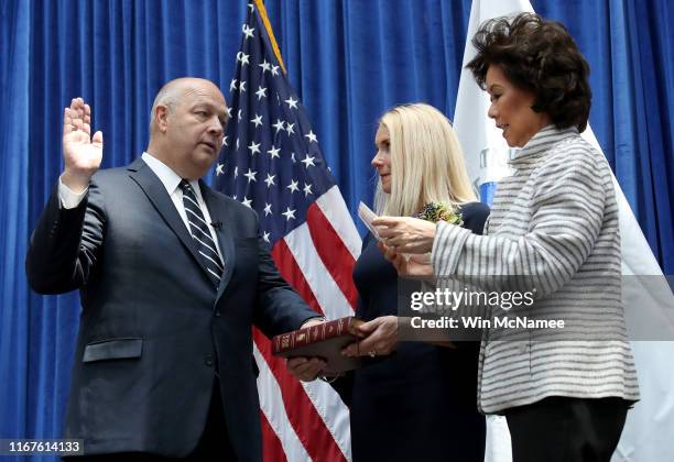 Stephen Dickson is sworn in as FAA administrator by Transportation Secretary Elaine Chao during a ceremony at the Department of Transportation August...