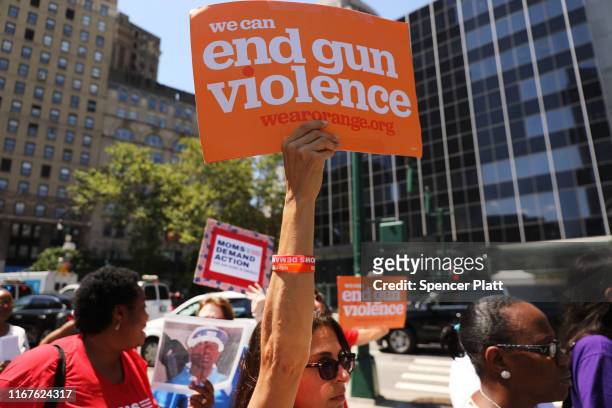 People participate in a demonstration and news conference against illegal guns in front of the Jacob Javits Federal Building on August 12, 2019 in...