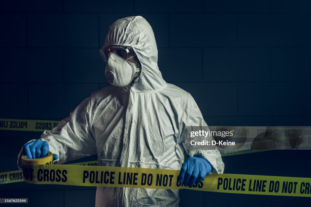 Portrait of forensic scientist at crime scene