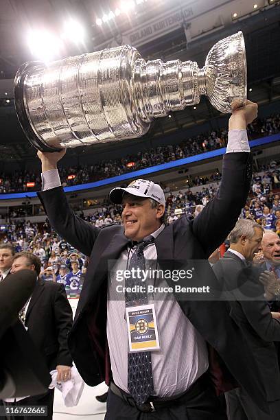 Boston Bruins president Cam Neely celebrates as he lifts the Stanley Cup after his team defeated the Vancouver Canucks in Game Seven of the 2011 NHL...