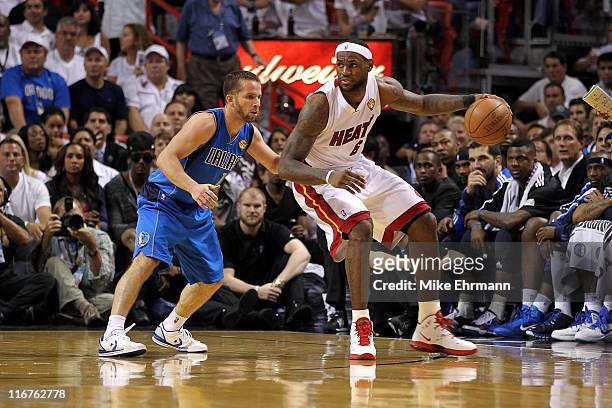 LeBron James of the Miami Heat posts up against Jose Juan Barea of the Dallas Mavericks in Game Six of the 2011 NBA Finals at American Airlines Arena...