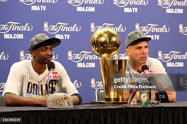 Jason Terry and Jason Kidd of the Dallas Mavericks answer questions from the media as the Larry O'Brien Championship trophy sits on the table during...