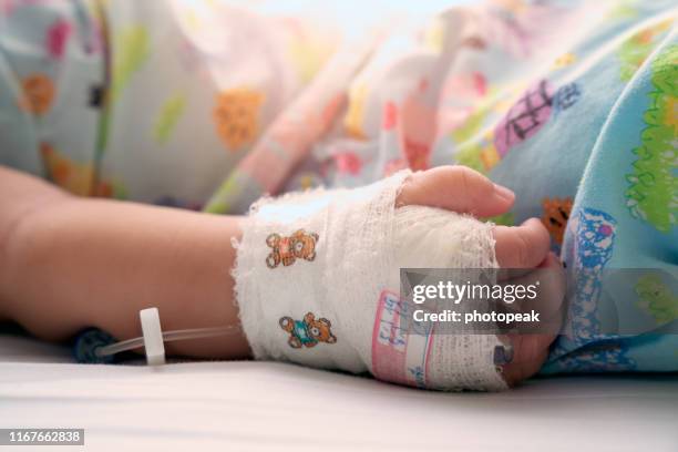 find & replace small boy, sick, must give saline,thailand - baby hospital stock pictures, royalty-free photos & images