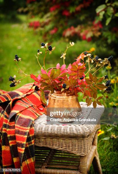 autumn bouquet on wicker table in the garden. autumn garden - fall bouquet stock pictures, royalty-free photos & images