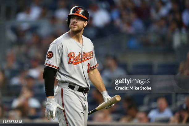 Chris Davis of the Baltimore Orioles reacts after striking out in third inning against the New York Yankees at Yankee Stadium on August 12, 2019 in...