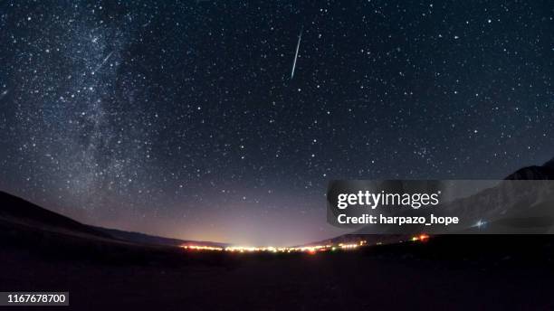 meteor above a small town in utah. - komet stock-fotos und bilder