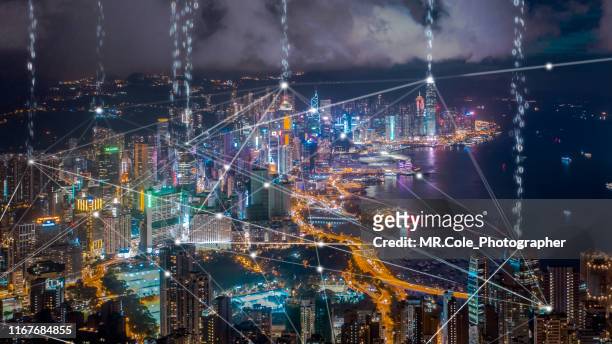 data transfer over hong kong city,connection and  wireless network technology.smart city,internet of things,big data,fin tech concept - big tech foto e immagini stock