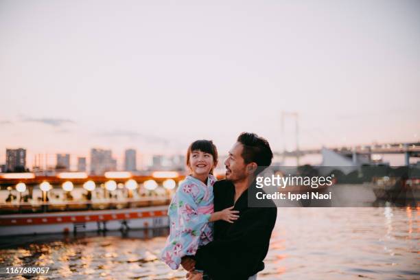 japanese father and preschool daughter wearing kimono on boat, tokyo - japan city stock pictures, royalty-free photos & images