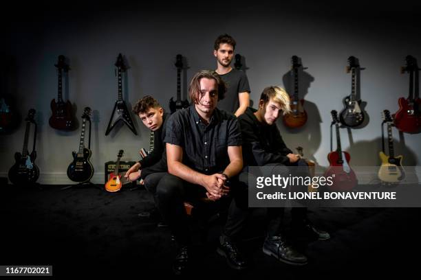 Last Train rock band members pose for a picture during a photo session on 12 September, 2019 in Paris, ahead of the release of their new album "The...
