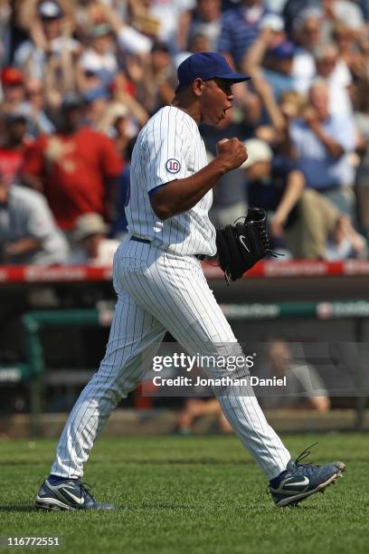 Carlos Marmol of the Chicago Cubs celebrates his 14th save of the season against the New York Yankees at Wrigley Field on June 17, 2011 in Chicago,...