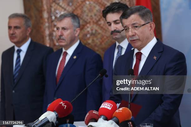 Former Turkish Prime Minister Ahmet Davutoglu holds a press conference at his home in Ankara on September 13 to announce that he would launch a "new...