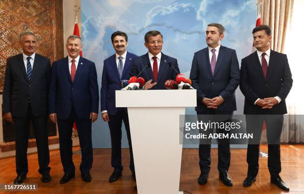 Former Turkish Prime Minister Ahmet Davutoglu holds a press conference at his office in Ankara on September 13 to announce that he would launch a...